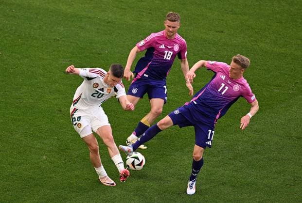RECORD DATE NOT STATED 19.06.2024, xjhx, Fussball EM 2024, Deutschland - Ungarn emspor, v.l. Roland Sallai (Ungarn), Maximilian Mittelstädt (Deutsche Fussball Nationalmannschaft DFB), Chris Führich (Deutsche Fussball Nationalmannschaft DFB) (UEFA REGULATIONS PROHIBIT ANY USE OF PHOTOGRAPHS as IMAGE SEQUENCES and or QUASI-VIDEO) Stuttgart