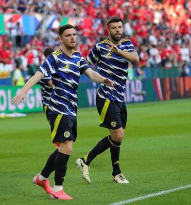 Scotland v Switzerland UEFA EURO, EM, Europameisterschaft,Fussball 2024 Group A Andrew Robertson (left) and Grant Hanley of Scotland warming up before the UEFA Euro 2024 Group A match between Scotland and Switzerland at RheinEnergieStadion, Cologne Copyright: xPaulxChestertonx FIL-20271-0061 UK Newspapers OUT
