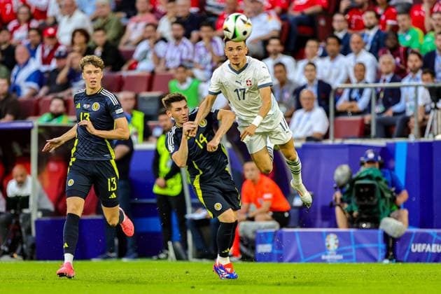 Scotland v Switzerland Euro 2024 19 06 2024. Group A Scotland midfielder Billy Gilmour and Switzerland midfielder Ruben Vargas clash in the air during the Euro 2024 match between Scotland and Switzerland at Rhein Energie Stadion, Cologne, Germany on 19 June 2024. Editorial use only , Copyright: xNigelxKeenex PSI-19821-0019