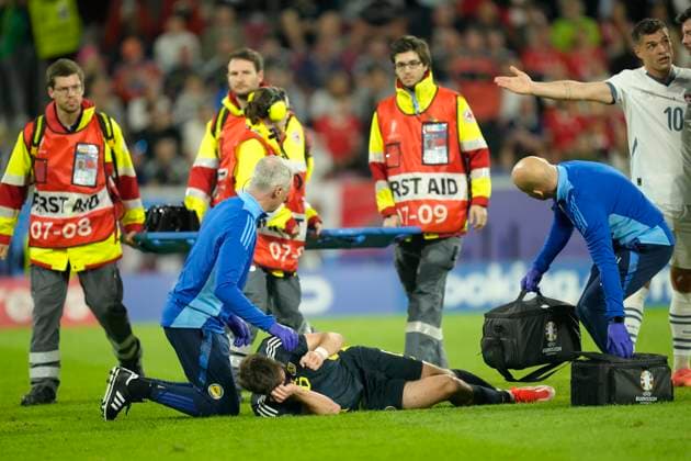 Scotland v Switzerland: Group A - UEFA EURO, EM, Europameisterschaft,Fussball 2024 Kieran Tierney left-Back of Scotland and Real Sociedad lies injured on the pitch during the UEFA EURO 2024 group stage match between Scotland and Switzerland at Cologne Stadium on June 19, 2024 in Cologne, Germany. Cologne Germany  Copyright: xJosexBretonx originalFilename:breton-scotland240619_npGJ1.jpg