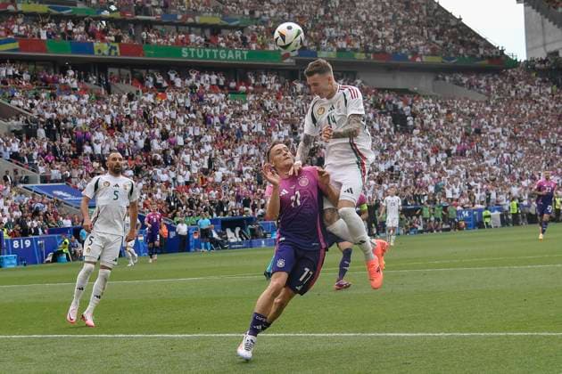v. li. im Kampf um den Ball Chris Führich Fuehrich ( 11, Deutschland) Bendeguz Bolla ( 14, Ungarn) 19.06.2024 Fussball Europameisterschaft in Deutschland Deutschland vs Ungarn, Neckarpark, Stuttgart, Baden-Württemberg Germany