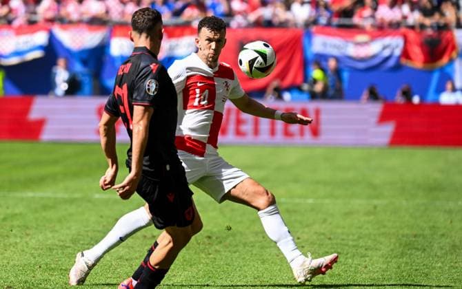 Hamburg, Germany, 190624. Volksparkstadion. UEFA EURO, EM, Europameisterschaft,Fussball 2024. Croatia - Albania, match of the second round of the European Championship, EM, Europameisterschaft group B. In the photo: Ivan Perisic and Kristjan Asllani. Photo: Ante Cizmic CROPIX Hamburg Germany Copyright: xxAntexCizmicx hrvatska_albanija323-190624