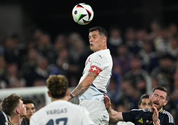 Fußball EURO 2024 Scotland - Switzerland 8712030 19.06.2024 Switzerland s Granit Xhaka, centre, heads a ball during the UEFA EURO, EM, Europameisterschaft,Fussball 2024 Group A soccer match between Scotland and Switzerland at the Cologne Stadium in Cologne, Germany. Alexey Filippov Sputnik Cologne Germany  Copyright: xAlexeyxFilippovx