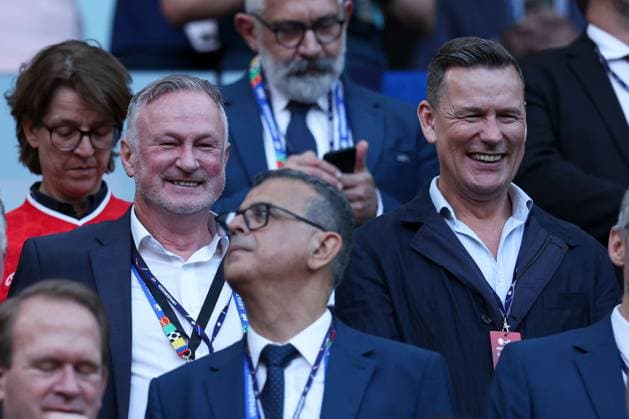 Chris Sutton (R) watches from the stands Scotland v Switzerland, UEFA European Championship, EM, Europameisterschaft 2024, Group A, Football, Cologne Stadium, Cologne, Germany, 19 Jun 2024 EDITORIAL USE ONLY No use with unauthorised audio, video, data, fixture lists, club league logos or live services. Online in-match use limited to 120 images, no video emulation. No use in betting, games or single club league player publications. Copyright: xMattxWest Shutterstockx 14543656cp