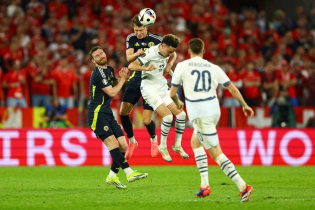 Jack Hendry of Scotland battles in the air Scotland v Switzerland, UEFA European Championship, EM, Europameisterschaft 2024, Group A, Football, Cologne Stadium, Cologne, Germany, 19 Jun 2024 EDITORIAL USE ONLY No use with unauthorised audio, video, data, fixture lists, club league logos or live services. Online in-match use limited to 120 images, no video emulation. No use in betting, games or single club league player publications. Copyright: xKieranxMcManus Shutterstockx 14543653ea