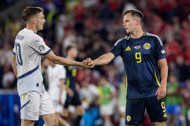 19th June 2024; Cologne Stadium, Cologne, Germany; Euro 2024 Group A Football, Scotland versus Switzerland; Michel Aebischer (SUI) shakes hands with Lawrence Shankland (SCO) at the final whistle  ActionPlus12657117 FotoxOlimpik