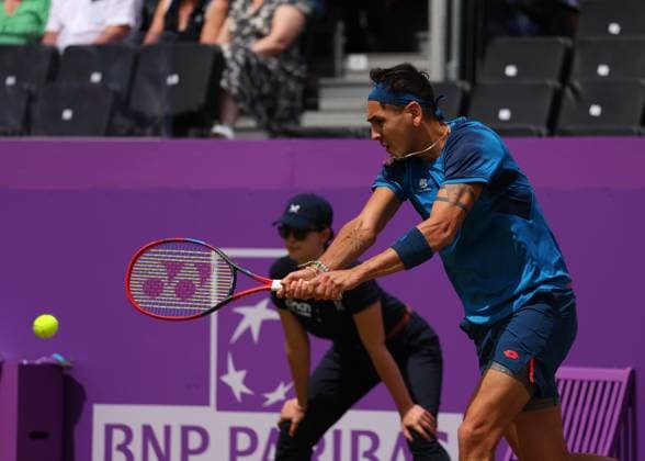 20th June 2024; Cinch Championships, Queens Club, West Kensington, London, England: Cinch Championships Queens Club, Day 4; Alejandro TABILO (CHI) with a backhand shot to Tommy PAUL (USA), mens singles match  ActionPlus12657179 JohnxPatrickxFletcher