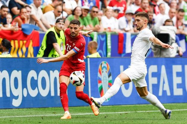 MUNCHEN, 20-06-2024, Allianz Arena. European Football Championship Euro2024, Group stage match no.18 between Slovenia and Serbia, Serbia player Filip Mladenovic, Slovenia player Adam Cerin Slovenia - Serbia (Euro2024)  x25540980x Copyright:
