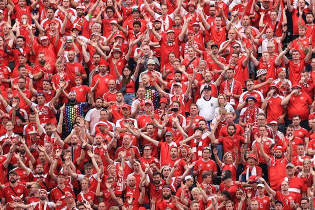 Football - UEFA EURO, EM, Europameisterschaft,Fussball 2024 - Group C - Denmark v England 20th June 2024 - UEFA EURO 2024 - Group C - Denmark v England - A couple of England fans in white shirts sit amongst the Denmark fans - Photo: Simon Stacpoole Offside. Frankfurt Germany Copyright: xSimonxStacpoolexOffside