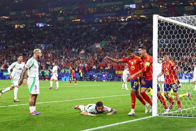 Spain v Italy 20 June 2024, Gelsenkirchen - UEFA EUROs - Group B - Spain v Italy - Lamine Yamal of Spain and Alvaro Morata of Spain celebrate their first goal as Riccardo Calafiori of Italy lays dejected on the ground - Photo: Charlotte Wilson Offside. Gelsenkirchen Germany Copyright: xCharlottexWilsonx xOffsidexOffside