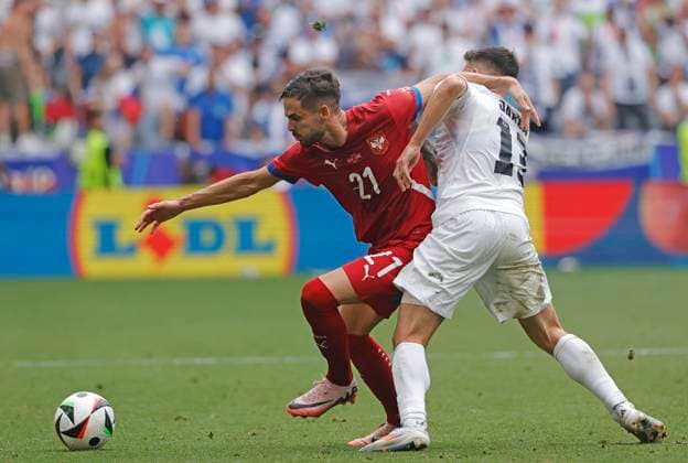 (240621) -- MUNICH, June 21, 2024 -- Mijat Gacinovic (L) of Serbia vies with Erik Janza of Slovenia during the UEFA EURO, EM, Europameisterschaft,Fussball 2024 Group C match between Slovenia and Serbia in Munich, Germany on June 20, 2024. (Photo by Xinhua) (SP)GERMANY-MUNICH-FOOTBALL-EURO 2024-SLOVENIA VS SERBIA PhilippexRuiz 
