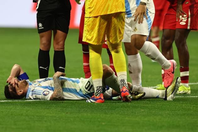 Argentina s forward Lionel Messi (bottom) gestures in pain during the Copa America USA 2024, group A, groupe stage match between Argentina and Canada, at Mercedes Benz stadium in Atlanta, on June 20, 2024. ATLANTA UNITED STATES Copyright: xALEJANDROxPAGNIx
