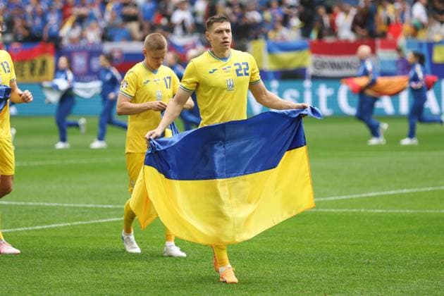 Mykola Matviyenko of Ukraine with the Ukraine flag Slovakia v Ukraine, UEFA European Championship, EM, Europameisterschaft 2024, Group E, Football, Dusseldorf Arena, Dusseldorf, Germany - 21 Jun 2024 EDITORIAL USE ONLY No use with unauthorised audio, video, data, fixture lists, club league logos or live services. Online in-match use limited to 120 images, no video emulation. No use in betting, games or single club league player publications. Copyright: xPaulxCurrie Shutterstockx 14543871j