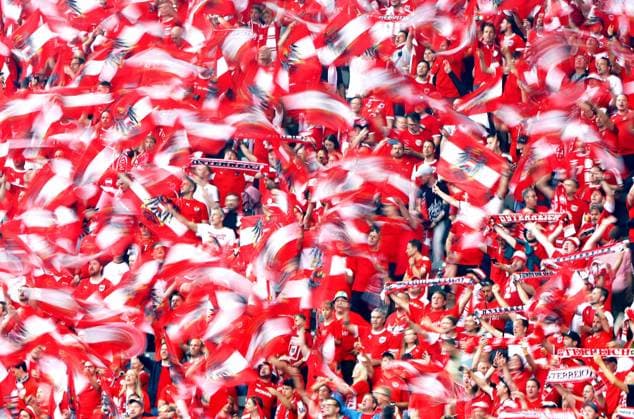Austrian fans wave their flags in the stadium ahead of kick off Poland v Austria, UEFA European Championship, EM, Europameisterschaft 2024, Group D, Football, Olympiastadion, Berlin, Germany, 21 Jun 2024 EDITORIAL USE ONLY No use with unauthorised audio, video, data, fixture lists, club league logos or live services. Online in-match use limited to 120 images, no video emulation. No use in betting, games or single club league player publications. Copyright: xKieranxMcManus Shutterstockx 14543876j