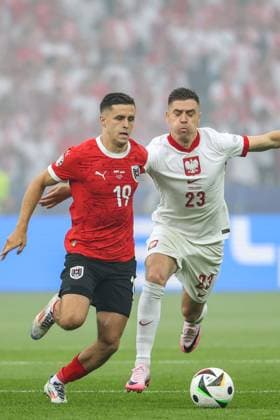 SOCCER - UEFA EURO, EM, Europameisterschaft,Fussball 2024 BERLIN,GERMANY,21.JUN.24 - UEFA EURO 2024, group stage, Austria vs Poland. Image shows Christoph Baumgartner (AUT) and Krzysztof Piatek (POL).  GEPAxpictures xArminxRauthner
