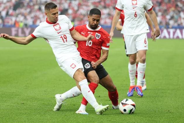 SOCCER - UEFA EURO, EM, Europameisterschaft,Fussball 2024 BERLIN,GERMANY,21.JUN.24 - UEFA EURO 2024, group stage, Austria vs Poland. Image shows Przemyslaw Frankowski (POL) and Phillipp Mwene (AUT).  GEPAxpictures xArminxRauthner