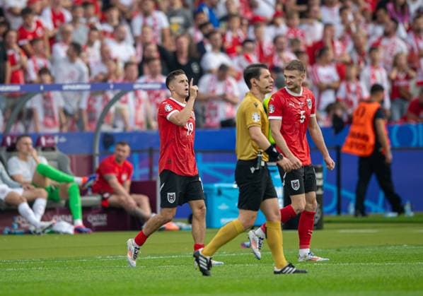 Fussball, Herren, Saison 2023 24, Euro 2024 Gruppe D (2. Spieltag) in Berlin, Polen - Österreich, v.l. Christoph Baumgartner (Österreich), Stefan Posch (Österreich), Jubel nach Tor zum 1:2, 21.06. 2024, Copyright: xSebastianxRäppold MatthiasxKochx