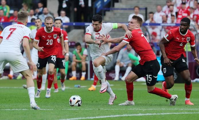 Konrad Laimer im Zweikampf mit Piotr Zielinski Fußball Fussball Europameisterschaft Euro 2024 EM Herren Saison 2023 2024 21.06.2024 Polen POL vs. Österreich AUT in Berlin DFL regulations prohibit any use of photographs as image sequences and or quasi-video.