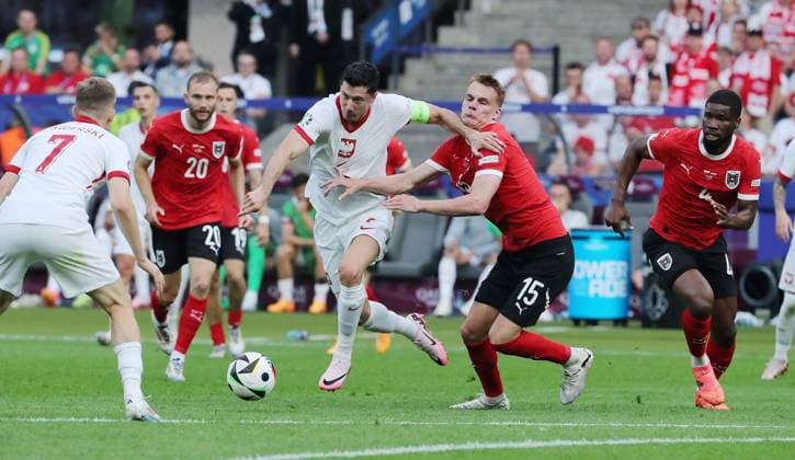 Konrad Laimer im Zweikampf mit Piotr Zielinski Fußball Fussball Europameisterschaft Euro 2024 EM Herren Saison 2023 2024 21.06.2024 Polen POL vs. Österreich AUT in Berlin DFL regulations prohibit any use of photographs as image sequences and or quasi-video.
