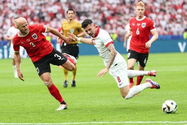 SOCCER - UEFA EURO, EM, Europameisterschaft,Fussball 2024 BERLIN,GERMANY,21.JUN.24 - UEFA EURO 2024, group stage, Austria vs Poland. Image shows Gernot Trauner (AUT) and Jakub Moder (POL).  GEPAxpictures xArminxRauthner