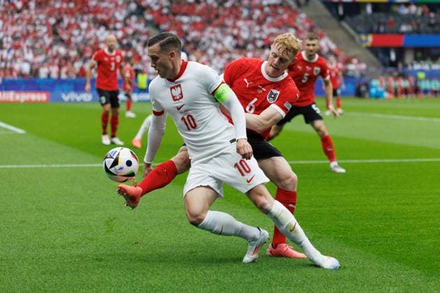 Piotr Zielinski in a duel with Nicolas Seiwald during UEFA EURO, EM, Europameisterschaft,Fussball 2024 game between national teams of Poland and Austria at Olympiastadion, Berlin, Germany (Maciej Rogowski) Berlin Olympiastadion Germany Copyright: xMaciejxRogowskix polaut-6-2
