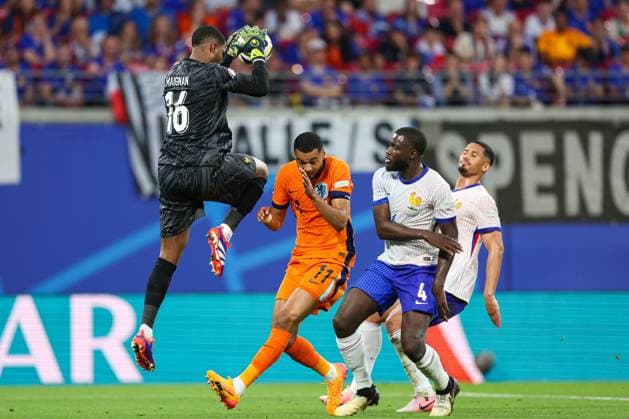 Netherlands v France: Group D - UEFA EURO, EM, Europameisterschaft,Fussball 2024 Mike Maignan of France catches the ball in front of Cody Gakpo of Netherlands and Dayot Upamecano of France during the UEFA EURO 2024 group stage match between Netherlands and France at Football Stadium Leipzig on June 21, 2024 in Leipzig, Germany. SanjinxStrukic PIXSELL