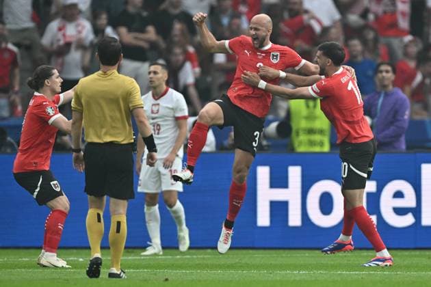 BERLIN, GERMANY - JUNE 21: Gernot Trauner of Austria celebrate with Florian Grillitsch after scoring the first goal for his team during to the UEFA EURO, EM, Europameisterschaft,Fussball 2024 group stage match between Poland and Austria at Olympiastadion on June 21, 2024 in Berlin, G Poland v Austria: Group D - UEFA EURO 2024 Copyright: xSebastianxFrejx