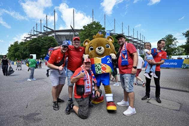 Czech fans pose with mascot Albart prior to the Group F match of the European Football Championship: Georgia vs Czechia, outside the Volksparkstadion in Hamburg, Germany, on June 22, 2024. (CTKxPhoto VitxSimanek) CTKPhotoP2024062202974  CTKPhotoP2024062202974