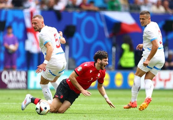 Vladimir Coufal of Czech Republic fouls Khvicha Kvaratskhelia of Georgia resulting in a yellow card Georgia v Czechia, UEFA European Championship, EM, Europameisterschaft 2024, Group F, Football, Volksparkstadion, Hamburg, Germany, 22 Jun 2024 EDITORIAL USE ONLY No use with unauthorised audio, video, data, fixture lists, club league logos or live services. Online in-match use limited to 120 images, no video emulation. No use in betting, games or single club league player publications. Copyright: xKieranxMcManus Shutterstockx 14548025t