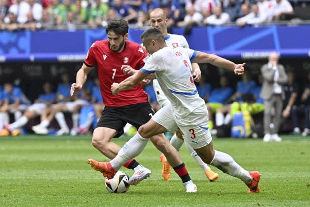 L-R Khvicha Kvaratskhelia (GEO) and Tomas Holes (CZE) in action during the Group F match of the European Football Championship: Georgia vs Czechia, in Hamburg, Germany, on June 22, 2024. (CTKxPhoto VitxSimanek) CTKPhotoP2024062203657  CTKPhotoP2024062203657