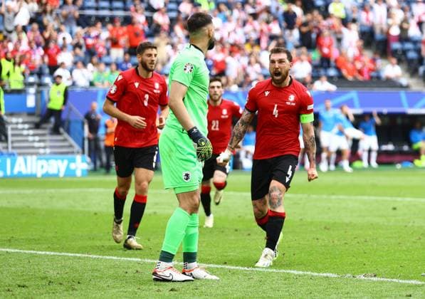 Guram Kashia of Georgia celebrates with Giorgi Mamardashvili of Georgia after making a save shortly before half time Georgia v Czechia, UEFA European Championship, EM, Europameisterschaft 2024, Group F, Football, Volksparkstadion, Hamburg, Germany, 22 Jun 2024 EDITORIAL USE ONLY No use with unauthorised audio, video, data, fixture lists, club league logos or live services. Online in-match use limited to 120 images, no video emulation. No use in betting, games or single club league player publications. Copyright: xKieranxMcManus Shutterstockx 14548025ai