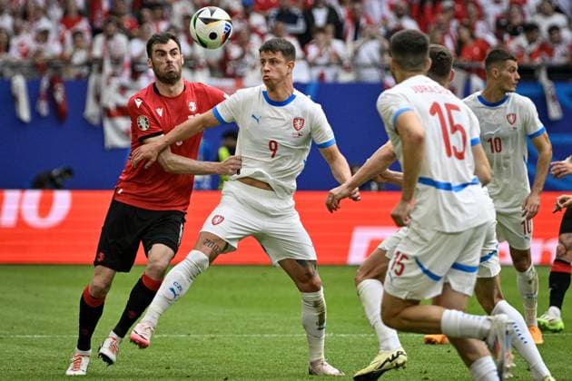 L-R Solomon Kvirkvelia (GEO) and Adam Hlozek (CZE) in action during the Group F match of the European Football Championship: Georgia vs Czechia, in Hamburg, Germany, on June 22, 2024. (CTKxPhoto VitxSimanek) CTKPhotoP2024062203901  CTKPhotoP2024062203901