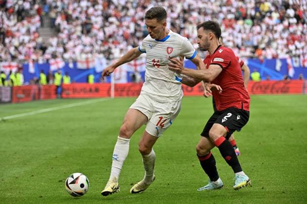L-R Lukas Provod (CZE) and Otar Kakabadze (GEO) in action during the Group F match of the European Football Championship: Georgia vs Czechia, in Hamburg, Germany, on June 22, 2024. (CTKxPhoto VitxSimanek) CTKPhotoP2024062204531  CTKPhotoP2024062204531