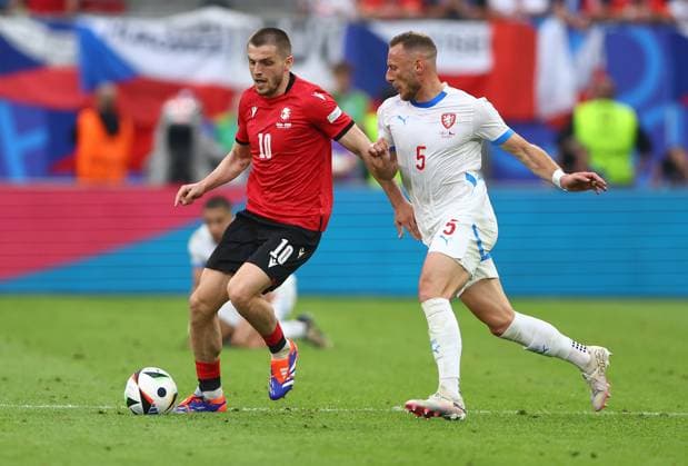 Giorgi Chakvetadze of Georgia is challenged by Vladimir Coufal of Czech Republic Georgia v Czechia, UEFA European Championship, EM, Europameisterschaft 2024, Group F, Football, Volksparkstadion, Hamburg, Germany, 22 Jun 2024 EDITORIAL USE ONLY No use with unauthorised audio, video, data, fixture lists, club league logos or live services. Online in-match use limited to 120 images, no video emulation. No use in betting, games or single club league player publications. Copyright: xKieranxMcManus Shutterstockx 14548025ea