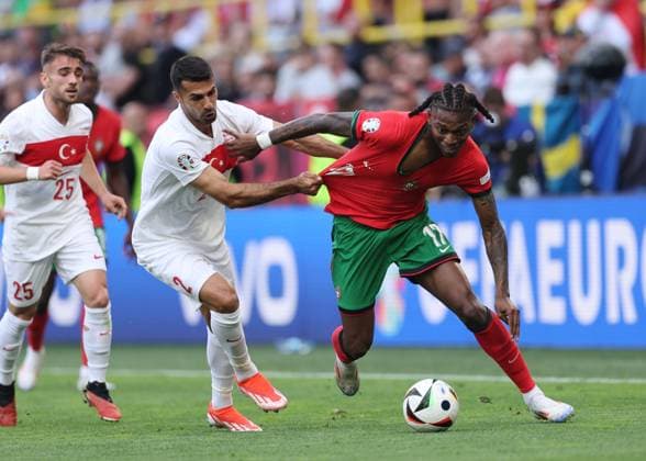 Dortmund, Germany, 22nd June 2024. Zeki Celik of Turkey tussles with Rafael Leao of Portugal during the UEFA European Championships match at BVB Stadion, Dortmund. Picture credit should read: David Klein Sportimage EDITORIAL USE ONLY. No use with unauthorised audio, video, data, fixture lists, club league logos or live services. Online in-match use limited to 120 images, no video emulation. No use in betting, games or single club league player publications. SPI-3202-0038
