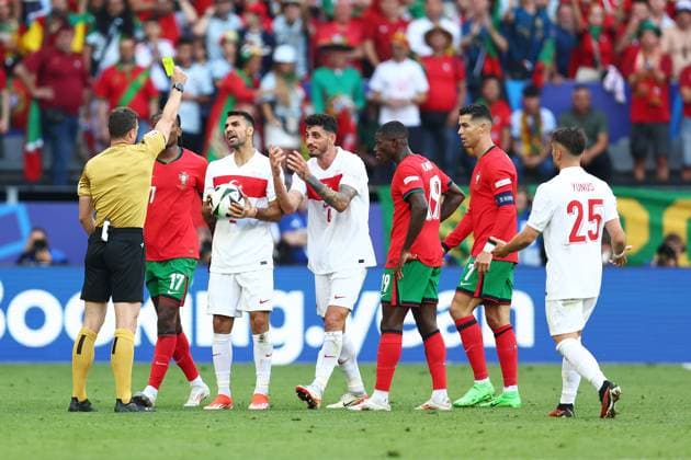 Turkey v Portugal 22 June 2024, Dortmund - UEFA EUROs - Group F - Turkey v Portugal - Referee Felix Zwayer shows a yellow card - Photo: Charlotte Wilson Offside. Dortmund Germany Copyright: xCharlottexWilsonx xOffsidexOffside