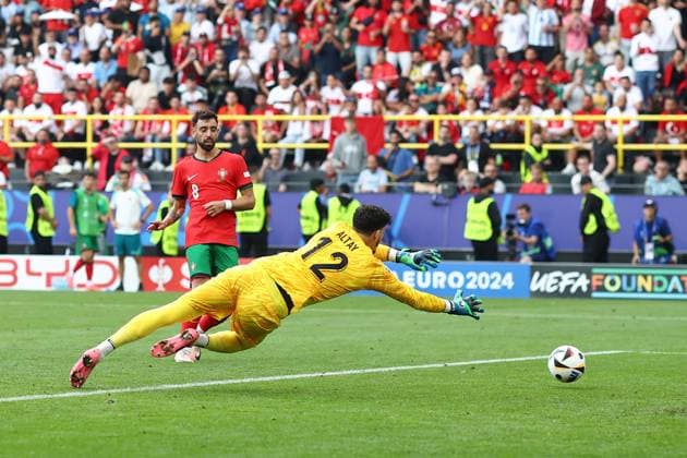 Turkey v Portugal 22 June 2024, Dortmund - UEFA EUROs - Group F - Turkey v Portugal - Bruno Fernandes of Portugal scores their 3rd goal - Photo: Charlotte Wilson Offside. Dortmund Germany Copyright: xCharlottexWilsonx xOffsidexOffside