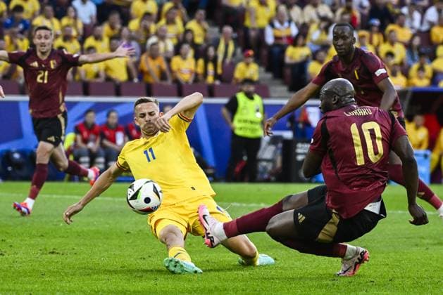 Romania s Nicusor Bancu and Belgium s Romelu Lukaku pictured in action during a soccer game between Belgian national soccer team Red Devils and Romania, Saturday 22 June 2024 in Cologne, Germany, the second match in the group stage of the UEFA EURO, EM, Europameisterschaft,Fussball 2024 European championships. DIRKxWAEM  x95079805x