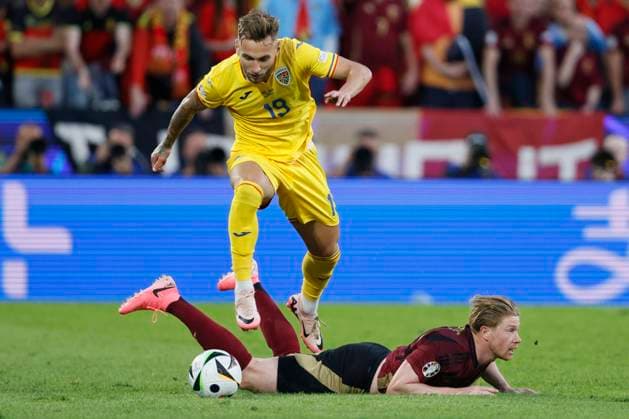 Belgium v Romania: Group E - UEFA EURO, EM, Europameisterschaft,Fussball 2024 Denis Dragus of Romania jumps over Kevin De Bruyne of Belgium during the UEFA EURO 2024 group stage match between Belgium and Romania at Cologne Stadium on June 22, 2024 in Cologne, Germany. Cologne Cologne Stadium Germany Germany Copyright: xRichardxSellers Sportsphoto APLx 14042146
