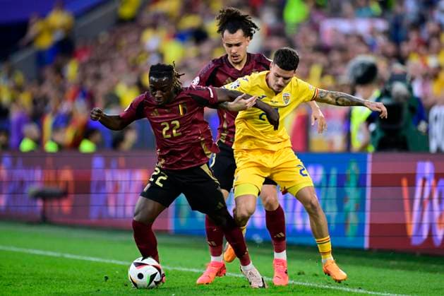 Belgium v Romania Group E - UEFA EURO, EM, Europameisterschaft,Fussball 2024 COLOGNE, GERMANY - JUNE 22 : Doku Jeremy forward of Belgium battles for the ball with Andrei Ratiu defender of Romania during the UEFA EURO 2024 European Football Championship tournament group E stage match between Belgium and Romania at Cologne Stadium on June 22, 2024 in Cologne, Germany, 22 06 2024 Cologne Germany  Copyright: xPeterxDexVoechtx
