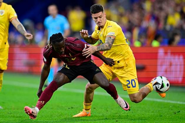 Belgium v Romania Group E - UEFA EURO, EM, Europameisterschaft,Fussball 2024 COLOGNE, GERMANY - JUNE 22 : Doku Jeremy forward of Belgium battles for the ball with Andrei Ratiu defender of Romania during the UEFA EURO 2024 European Football Championship tournament group E stage match between Belgium and Romania at Cologne Stadium on June 22, 2024 in Cologne, Germany, 22 06 2024 Cologne Germany  Copyright: xPeterxDexVoechtx