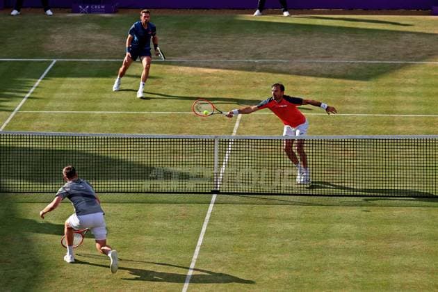 22nd June 2024; Cinch Championships, Queens Club, West Kensington, London, England: Cinch Championships Queens Club, Day 6; Neal Skupski (GBR) and Michael Venus (NZL) compete during the mens doubles semifinal match against Ivan Dodig (CRO) and Austin Krajicek (USA)  ActionPlus12658852 ShaunxBrooks