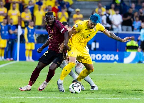 Koeln, RheinEnergieStadion, 22.06.2024: Jeremy Doku of belgium challenges Andrei Ratiu of romania during the match UEFA European Championship, EM, Europameisterschaft 2024 Belgium v. Romania.