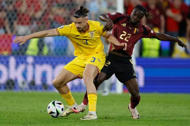 Belgium v Romania: Group E - UEFA EURO, EM, Europameisterschaft,Fussball 2024 Radu Dragusin of Romania and Jeremy Doku of Belgium challenge during the UEFA EURO 2024 group stage match between Belgium and Romania at Cologne Stadium on June 22, 2024 in Cologne, Germany. Cologne Cologne Stadium Germany Germany Copyright: xRichardxSellers Sportsphoto APLx 14042158