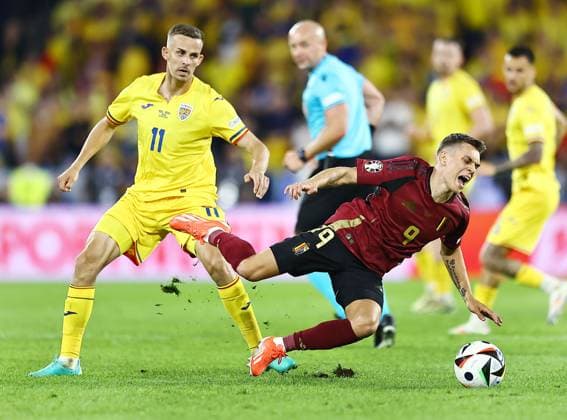Leandro Trossard of Belgium is brought down by Nicusor Bancu of Romania Belgium v Romania, UEFA European Championship, EM, Europameisterschaft 2024, Group E, Football, Cologne Stadium, Cologne, Germany, 22 Jun 2024 EDITORIAL USE ONLY No use with unauthorised audio, video, data, fixture lists, club league logos or live services. Online in-match use limited to 120 images, no video emulation. No use in betting, games or single club league player publications. Copyright: xMichaelxZemanek Shutterstockx 14548045bp