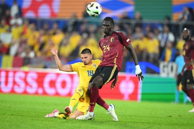 Belgium v Romania Group E - UEFA EURO, EM, Europameisterschaft,Fussball 2024 COLOGNE, GERMANY - JUNE 22 : Onana Amadou midfielder of Belgium in duel with Razvan Marin midfielder of Romania during the UEFA EURO 2024 European Football Championship tournament group E stage match between Belgium and Romania at Cologne Stadium on June 22, 2024 in Cologne, Germany, 22 06 2024 Cologne Germany  Copyright: xVincentxKalutx