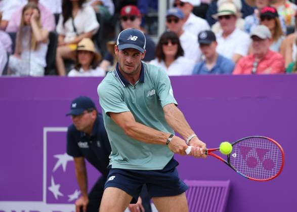 23rd June 2024; Cinch Championships, Queens Club, West Kensington, London, England: Cinch Championships Queens Club, Day 7; Tommy Paul (USA) with a backhand shot to Lorenzo Musetti (ITA), mens singles match  ActionPlus12659195 JohnxPatrickxFletcher