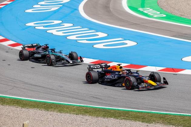 BARCELONA, SPAIN - JUNE 23: Max Verstappen (1) of Netherlands and team Oracle Red Bull Racing passes George Russell (63) of United Kingdom and team Mercedes-AMG Petronas F1 Team to take the lead during the Formula 1 Spanish Grand Prix on Sunday, June 23, 2024 at the Circuit De Catalunya in Barcelona, Spain. (Photo by Bob Kupbens Icon Sportswire) AUTO: JUN 23 F1 Spanish Grand Prix EDITORIAL USE ONLY Icon240623080