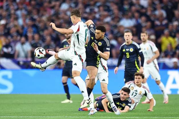 Willi Orban of Hungary and Chà Adams of Scotland Scotland v Hungary, UEFA European Championship, EM, Europameisterschaft 2024, Group A, Football, Stuttgart Arena, Stuttgart, Germany, 23 Jun 2024 EDITORIAL USE ONLY No use with unauthorised audio, video, data, fixture lists, club league logos or live services. Online in-match use limited to 120 images, no video emulation. No use in betting, games or single club league player publications. Copyright: xMichaelxZemanek Shutterstockx 14548075n