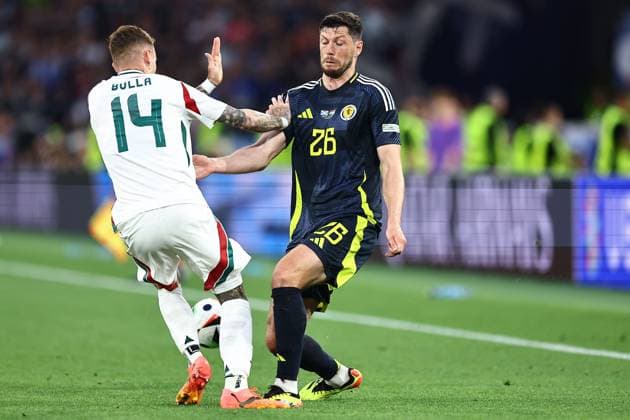 Bendeguz Bolla of Hungary and Scott McKenna of Scotland Scotland v Hungary, UEFA European Championship, EM, Europameisterschaft 2024, Group A, Football, Stuttgart Arena, Stuttgart, Germany, 23 Jun 2024 EDITORIAL USE ONLY No use with unauthorised audio, video, data, fixture lists, club league logos or live services. Online in-match use limited to 120 images, no video emulation. No use in betting, games or single club league player publications. Copyright: xMichaelxZemanek Shutterstockx 14548075u